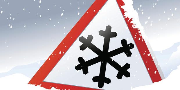 Road sign warning of the dangers of winter
